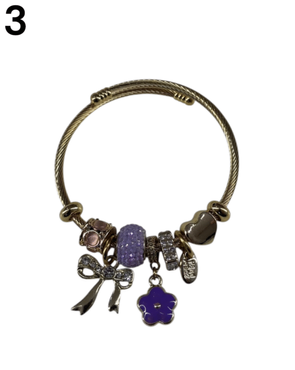 Pulsera con charms de acero dorado