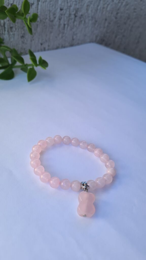 Pulsera de Cuarzo rosa con detalle de huesito