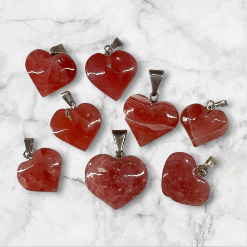 Dije de Rodocrosita corazón calidad ortiz con plata