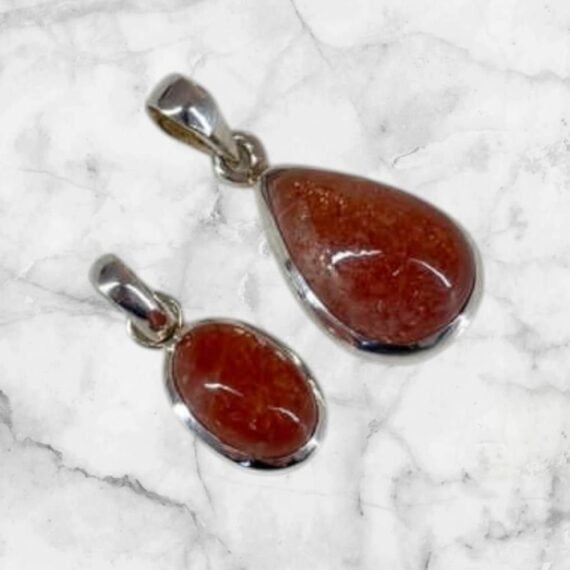 Dije piedra del sol engazado en plata